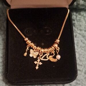a new day Gold Charm Necklace with Heart and Cross